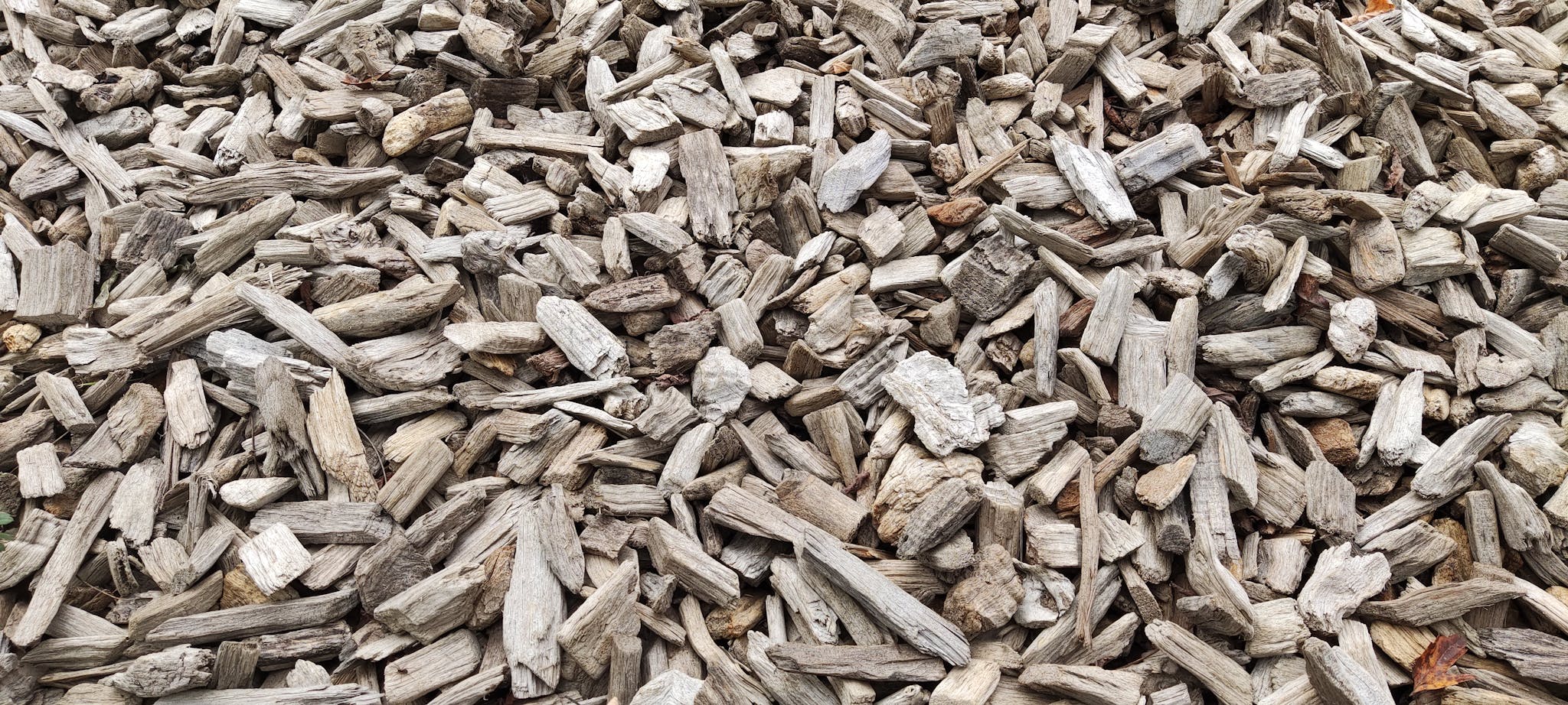 Textured pile of dry wood pieces in Budapest for fuel use.